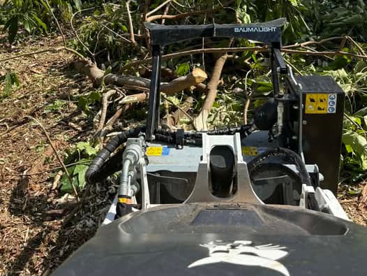 Bobcat MT120 mini track loader performing low-impact land clearing